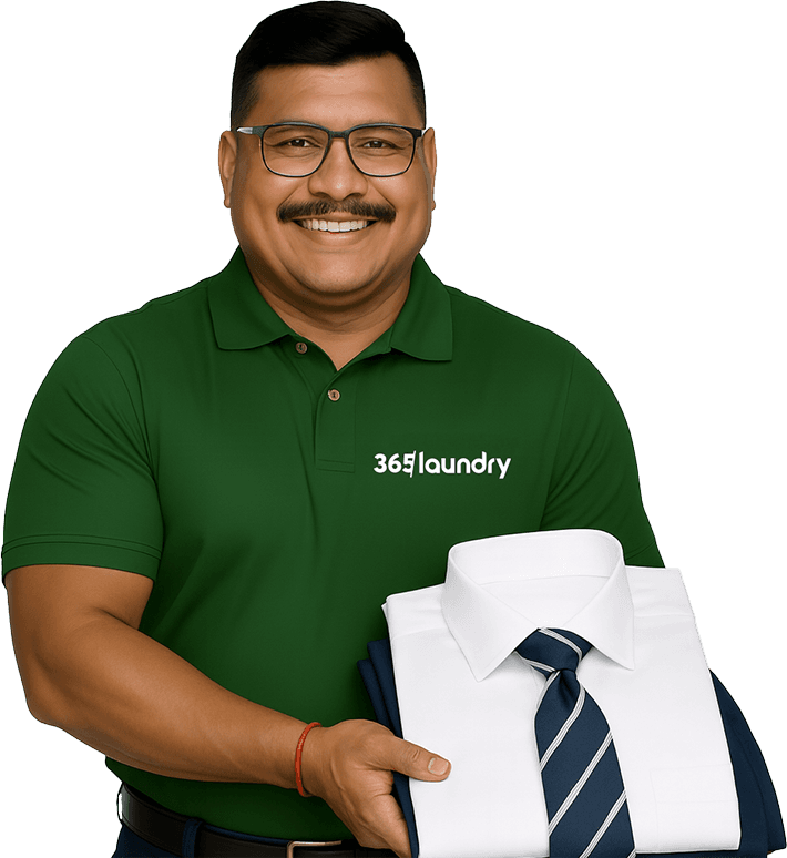 365 Laundry Professional holding a clean shirt